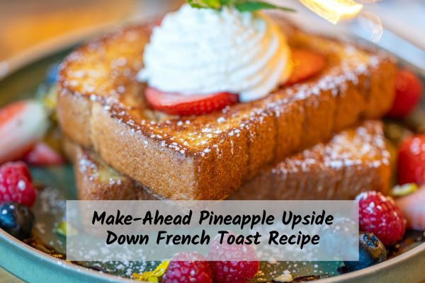 French toast plated with fruit and whipped cream
