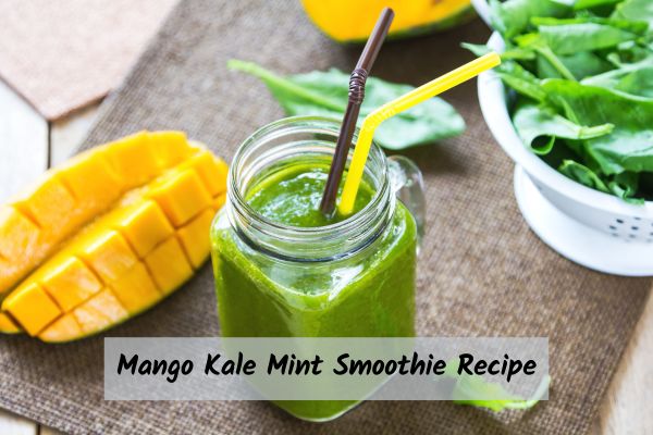 Mango_Kale_Mint_Smoothie_Recipe Green smoothie with mango and fresh greens including mint and kale.
