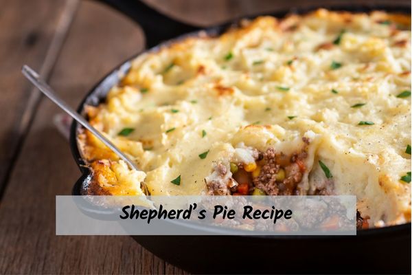 Shepherds_Pie_Recipe Shepherd's pie in a black skillet with a fork digging into it.