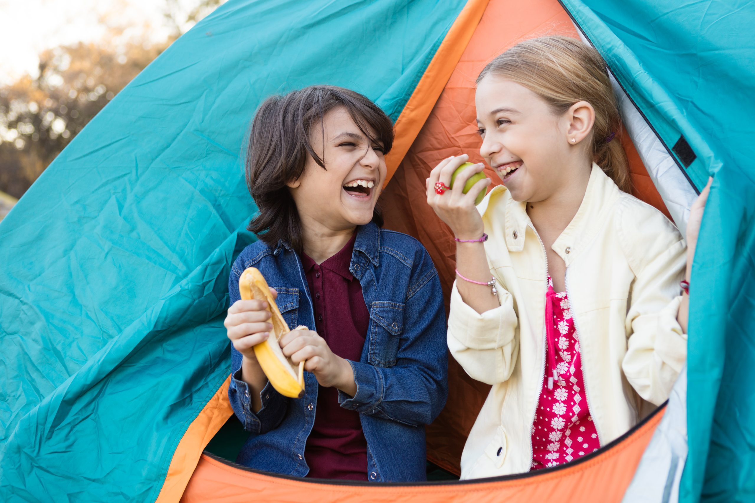 Kids eating healthy snacks camping