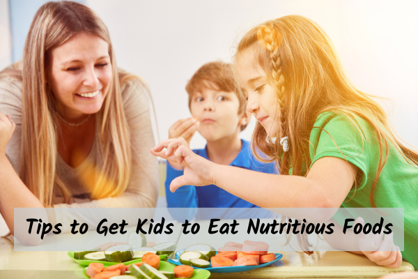 Teaching Kids About Nutritious Foods Mother teaching two kids about nutrition