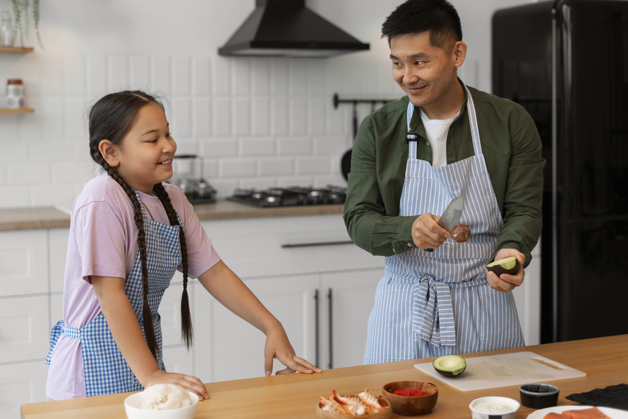 Parent_Teaching_Kid_How_to_Make_Sushi parent teaching child how to make sushi