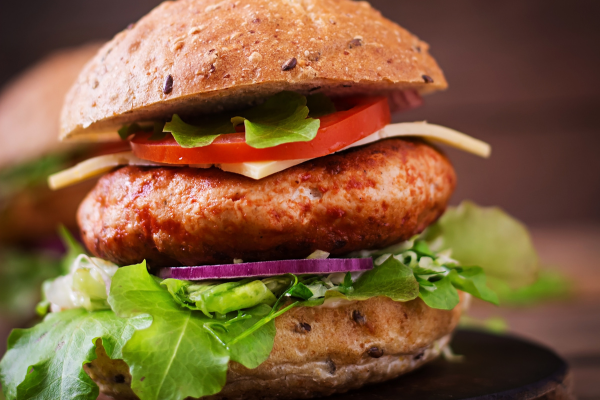 Asian chicken burger on a bun with fresh veggies