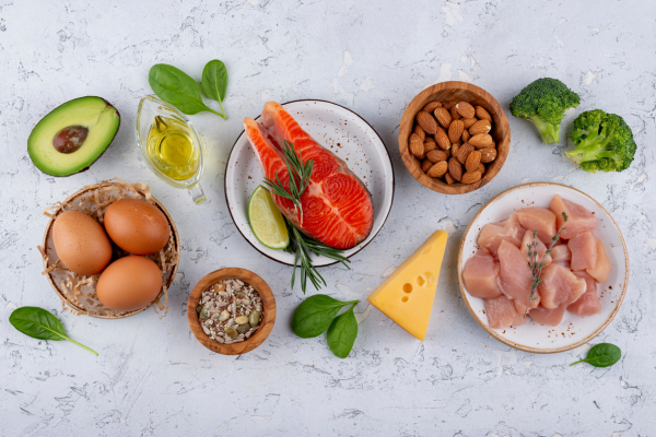 high protein foods including chicken, eggs, fish, nuts, and seeds