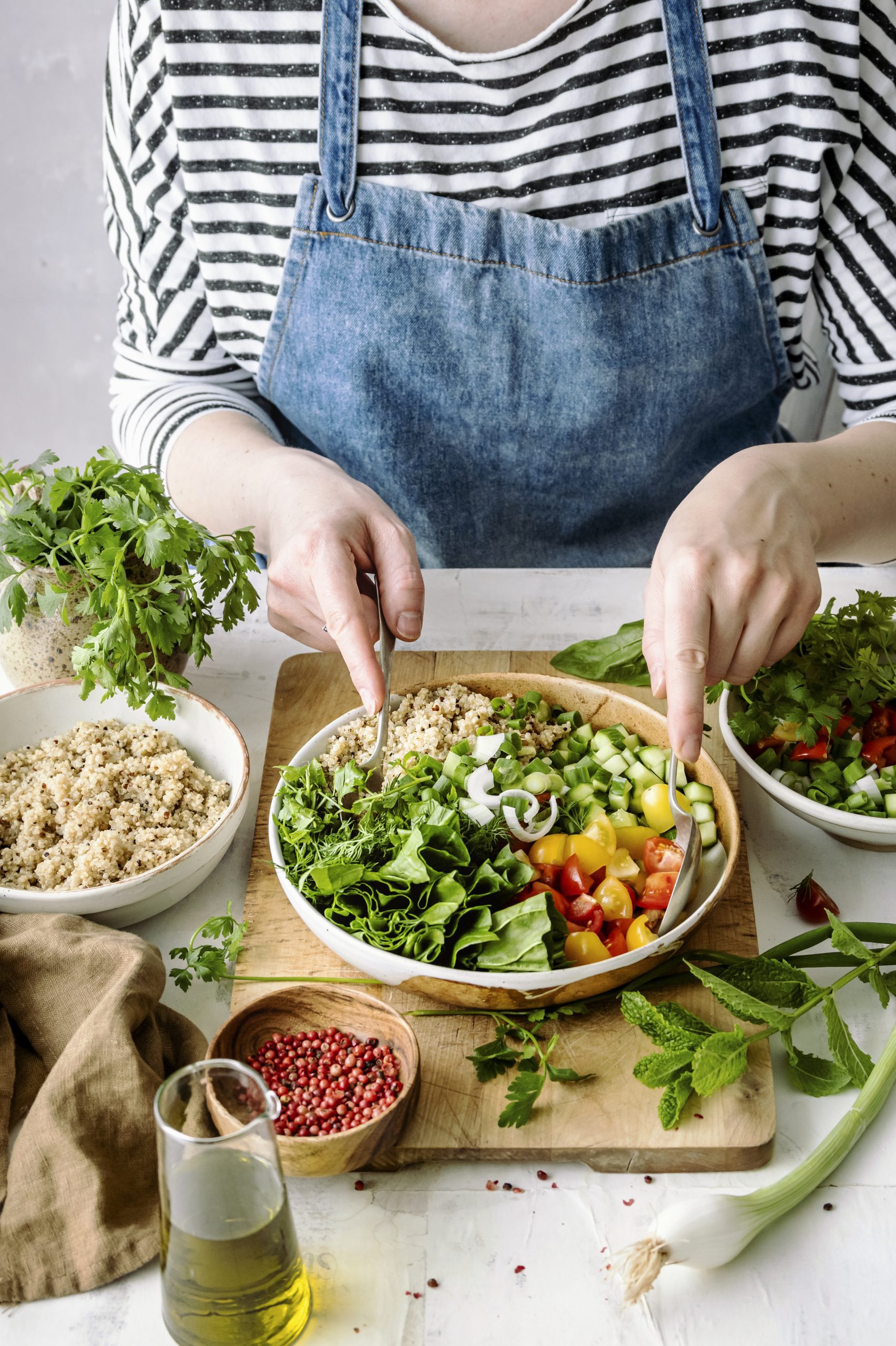Preparing plant-based recipe idea a woman preparing a plant-based salad