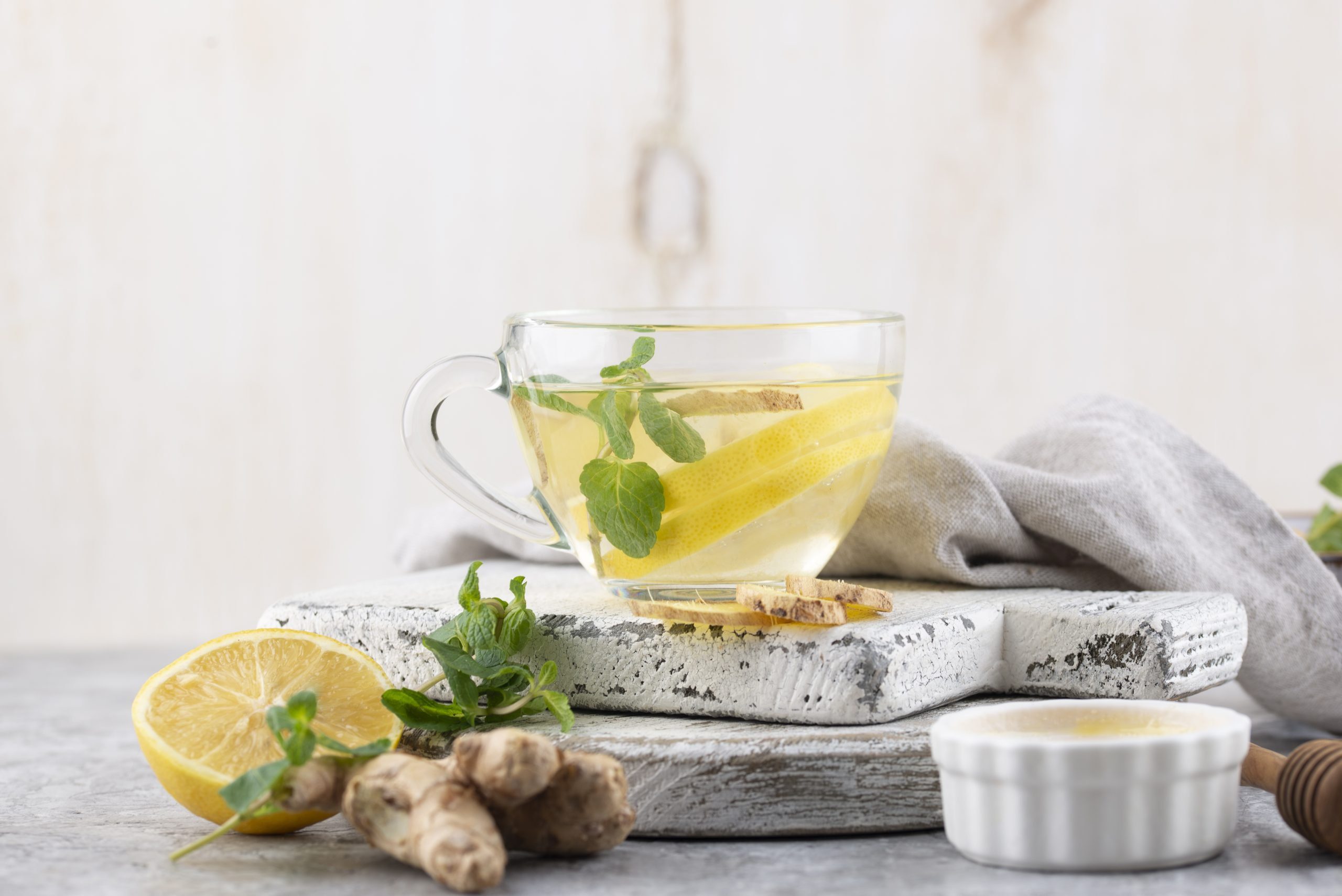 Ginger_Peppermint_Tea Peppermint tea with ginger root and lemon on the side