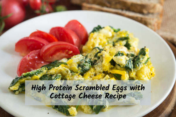 plate of scrambled eggs with spinach and tomatoes