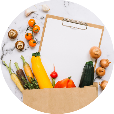 Meal Prep Pro Feature paper bag filled with a note pad and veggies