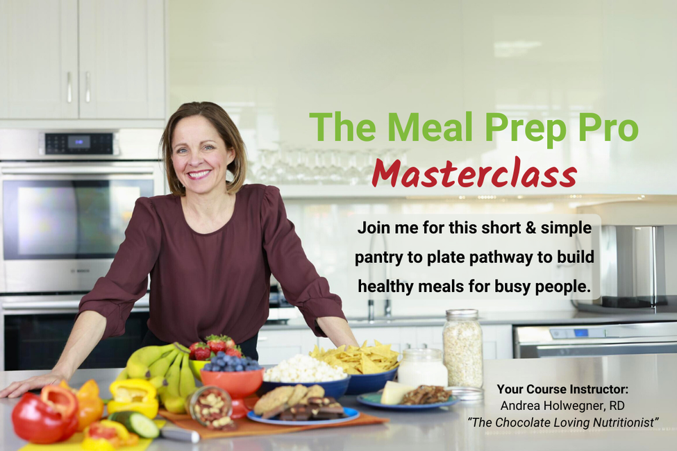 andrea holwegner standing in a kitchen with soulful and healthful foods