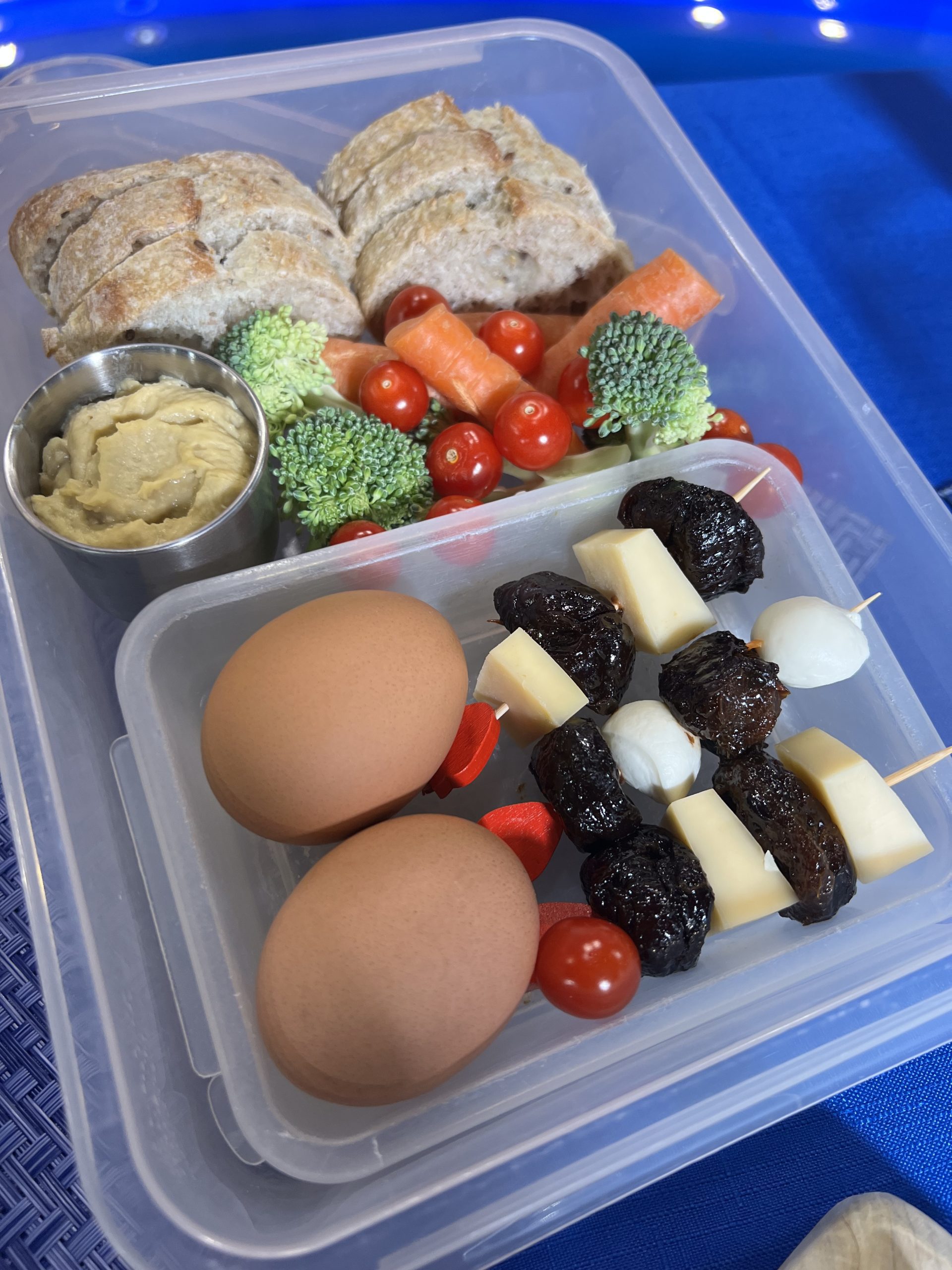Bento Box with cheese skwers, prunes, and hard boiled eggs Bento Box with cheese skwers, prunes, and hard boiled eggs