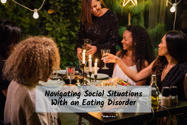 Group of people at a dinner party being served a beverage 