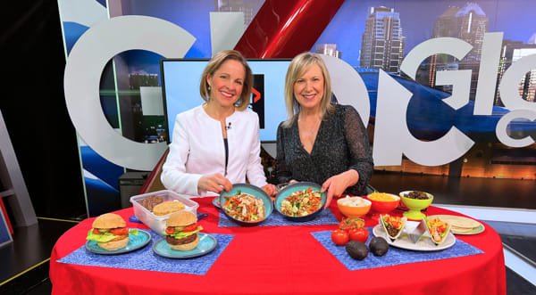 Food-Industry-Nutritionist-e1737479990241 andrea holwegner and global news anchor showing power bowls for a nutrition segment