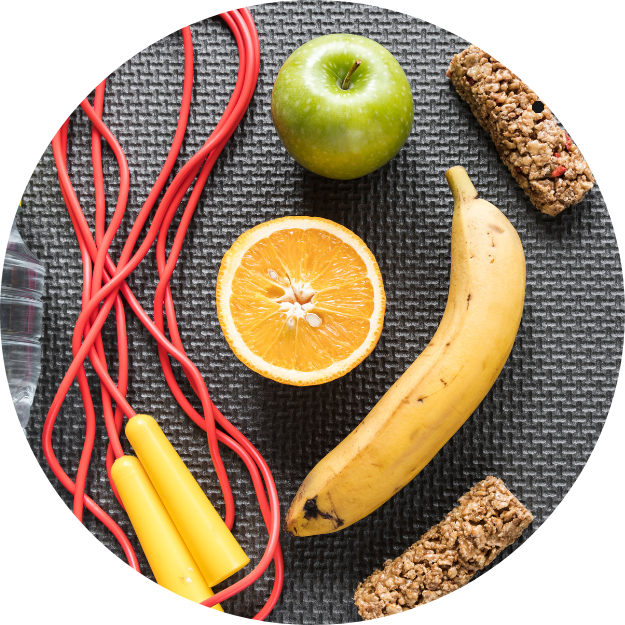 Sports_Nutrition_Performance_Seminar banana orange apple and granola bars next to a jumping rope