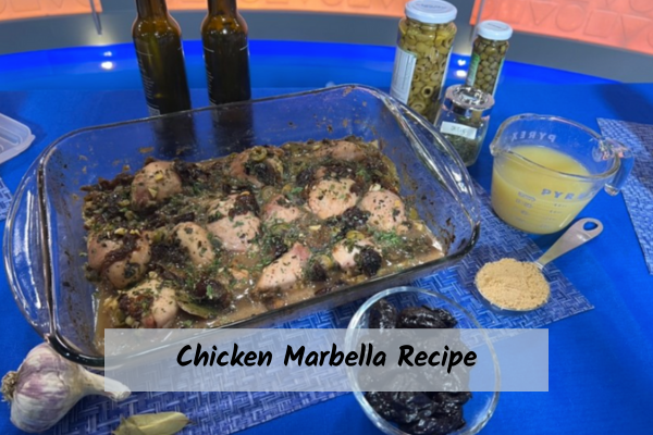 chicken marbella recipe in a glass pan with different ingredients on the table