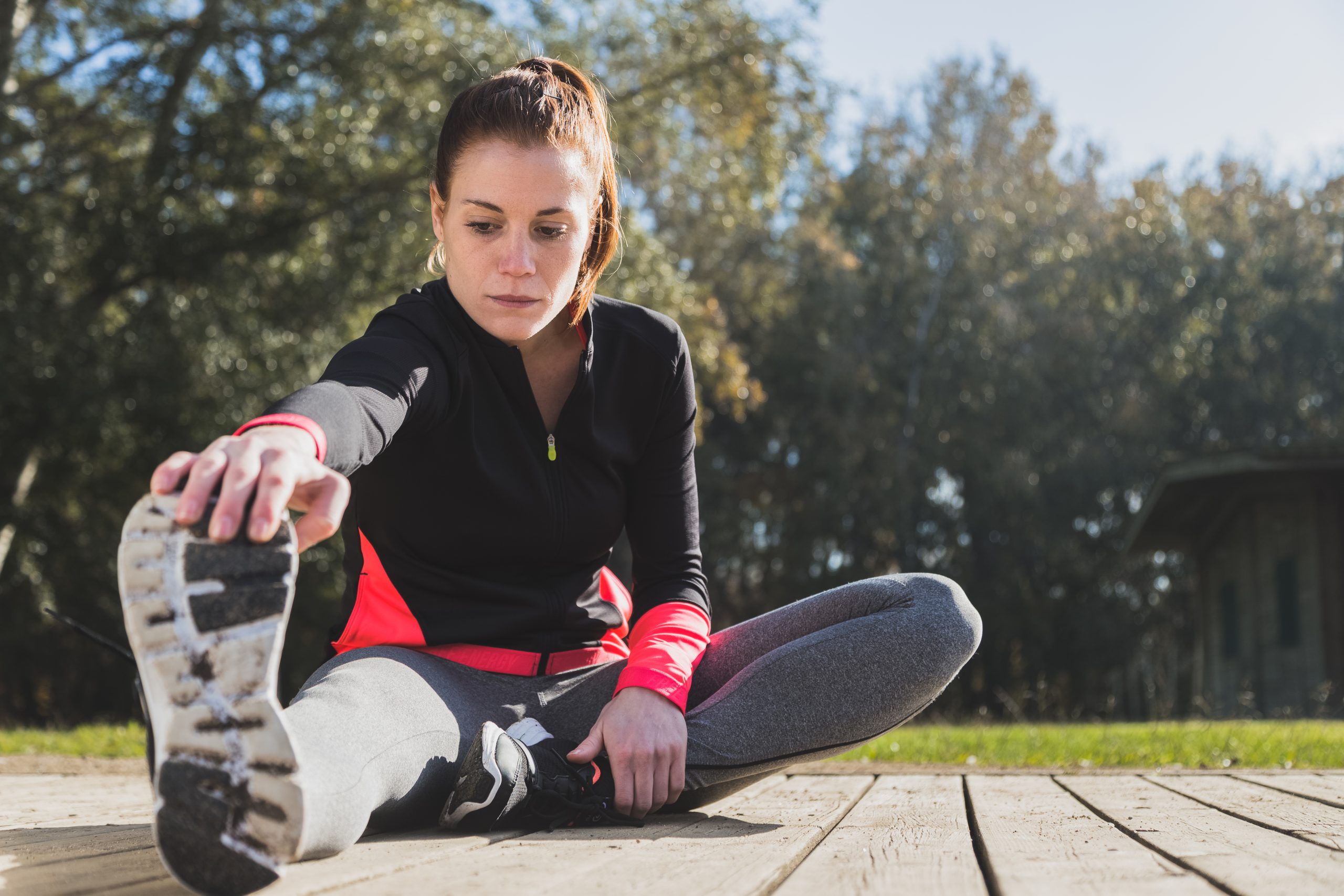 Woman stretching on the ground