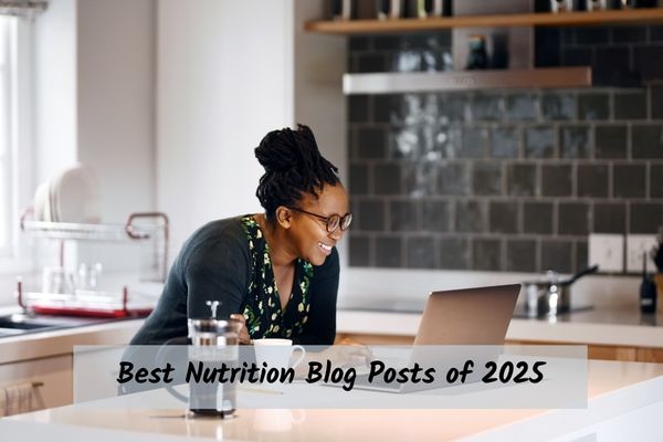 Best-Blog-Posts-2025 Person looking at a laptop & drinking coffee