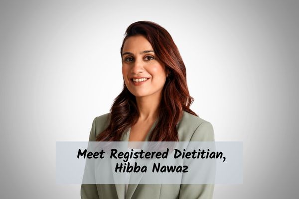 Meet-Registered-Dietitian-Hibba-Nawaz registered dietitian hibba nawaz in a green blazer smiling